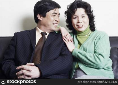 Portrait of a mature woman sitting with a mature man