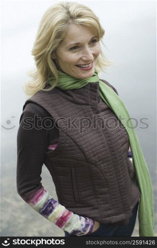 Portrait of a mature woman smiling at the lakeside