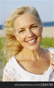 Portrait of a mature woman smiling on the beach