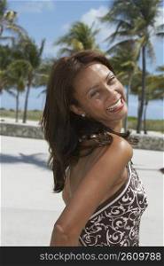 Portrait of a mature woman smiling on the beach, South Beach, Miami Beach, Florida, USA