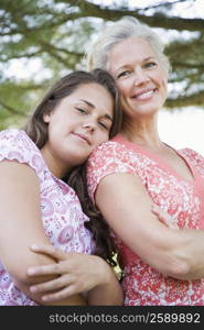 Portrait of a mature woman smiling with her daughter