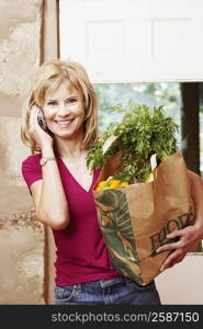 Portrait of a mature woman talking on a mobile phone and smiling