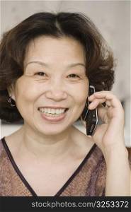 Portrait of a mature woman talking on a mobile phone and smiling