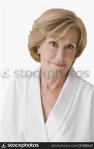 Portrait of a mature woman wearing a bathrobe and smiling