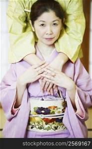 Portrait of a mature woman wearing a Kimono