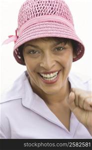 Portrait of a mature woman wearing hat and smiling