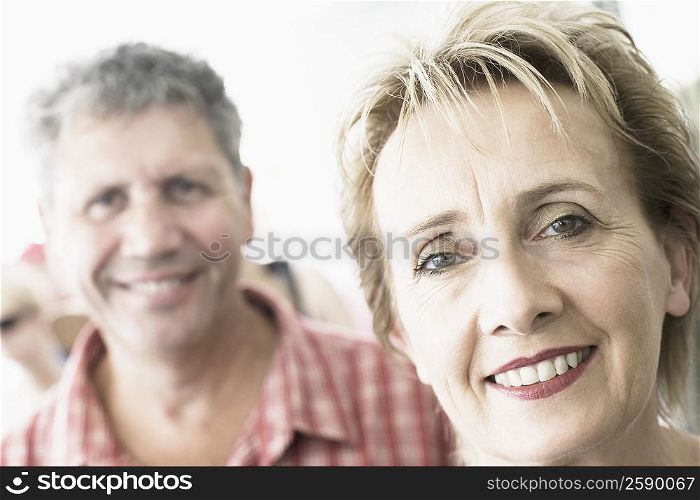 Portrait of a mature woman with a senior man smiling