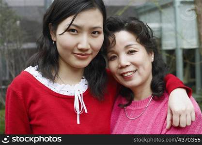 Portrait of a mature woman with her daughter