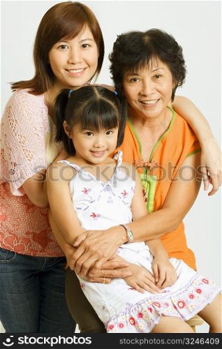 Portrait of a mature woman with her daughter and her granddaughter