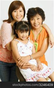 Portrait of a mature woman with her daughter and her granddaughter