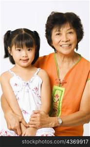 Portrait of a mature woman with her granddaughter