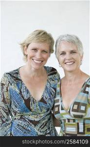 Portrait of a mature woman with her sister smiling
