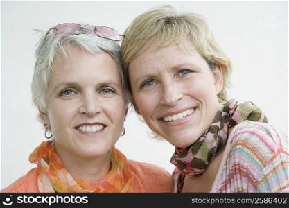 Portrait of a mature woman with her sister smiling