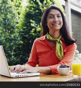 Portrait of a mature woman working on a laptop