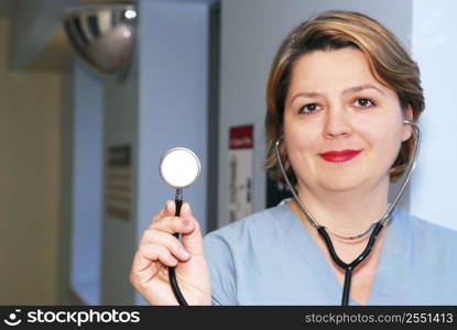 Portrait of a medical doctor or nurse holding a stethoscope