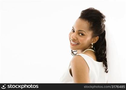 Portrait of a mid-adult African-American bride on white background.