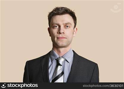 Portrait of a mid adult business professional over colored background