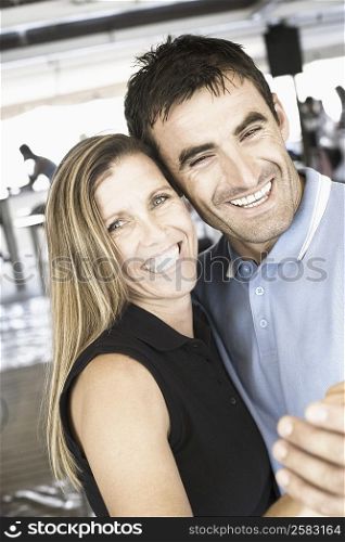 Portrait of a mid adult couple dancing in a nightclub and smiling