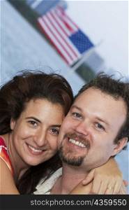 Portrait of a mid adult couple embracing each other and smiling