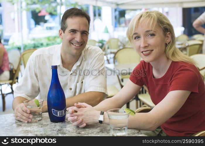 Portrait of a mid adult couple sitting in a restaurant