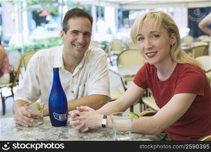 Portrait of a mid adult couple sitting in a restaurant