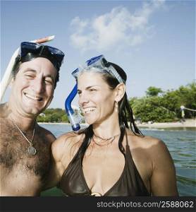 Portrait of a mid adult couple smiling on the beach