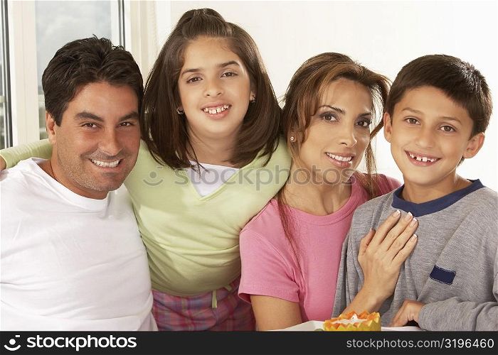 Portrait of a mid adult couple with their children
