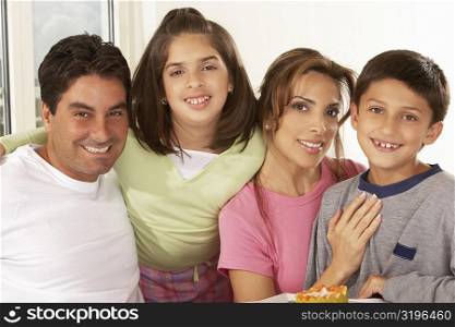 Portrait of a mid adult couple with their children