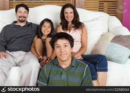 Portrait of a mid adult couple with their son and daughter