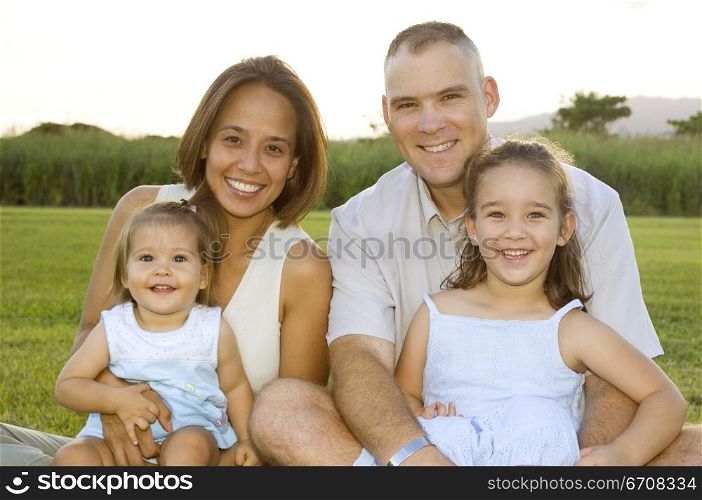 Portrait of a mid adult couple with their two children