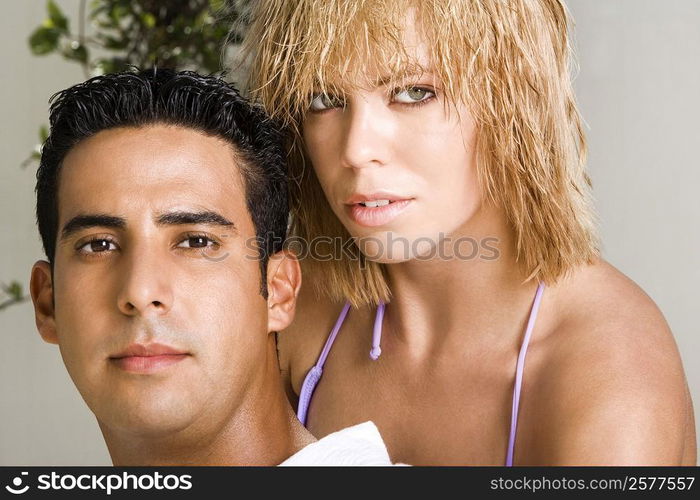 Portrait of a mid adult man and a young woman