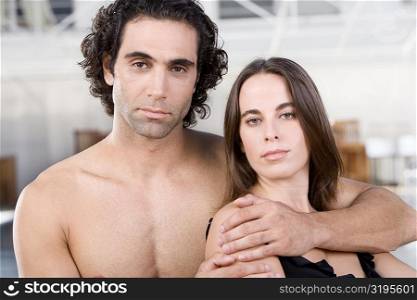 Portrait of a mid adult man and a young woman