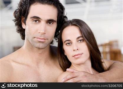 Portrait of a mid adult man and a young woman