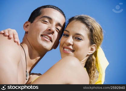 Portrait of a mid adult man and a young woman hugging