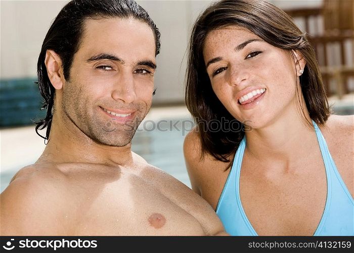 Portrait of a mid adult man and a young woman smiling