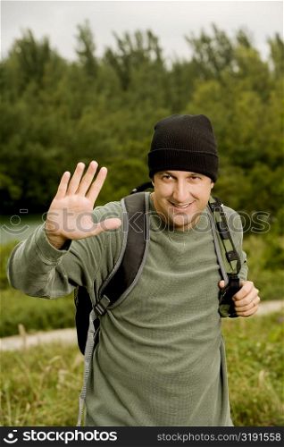 Portrait of a mid adult man carrying a backpack