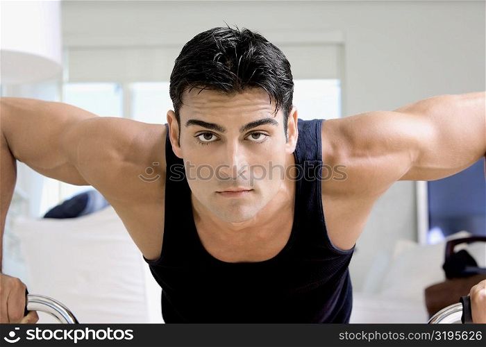 Portrait of a mid adult man doing push-ups