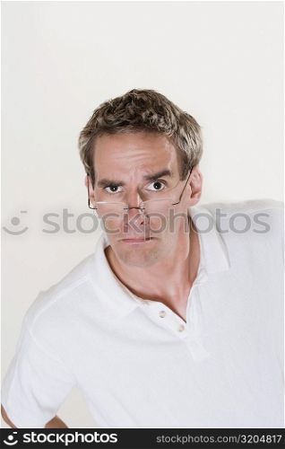 Portrait of a mid adult man frowning