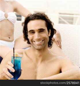 Portrait of a mid adult man holding a cocktail