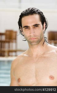 Portrait of a mid adult man near a swimming pool