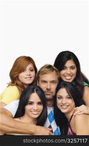 Portrait of a mid adult man posing with four young women