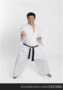 Portrait of a mid adult man practicing martial arts