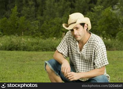 Portrait of a mid adult man sitting in the garden