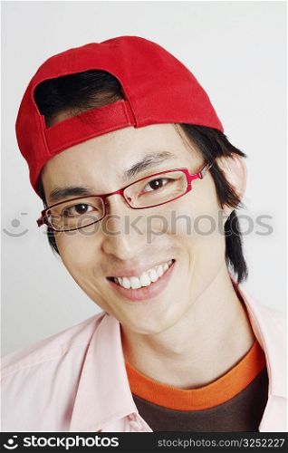 Portrait of a mid adult man smiling and wearing eyeglasses