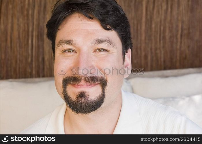 Portrait of a mid adult man smirking