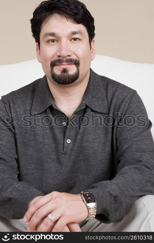 Portrait of a mid adult man smirking