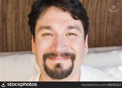 Portrait of a mid adult man smirking