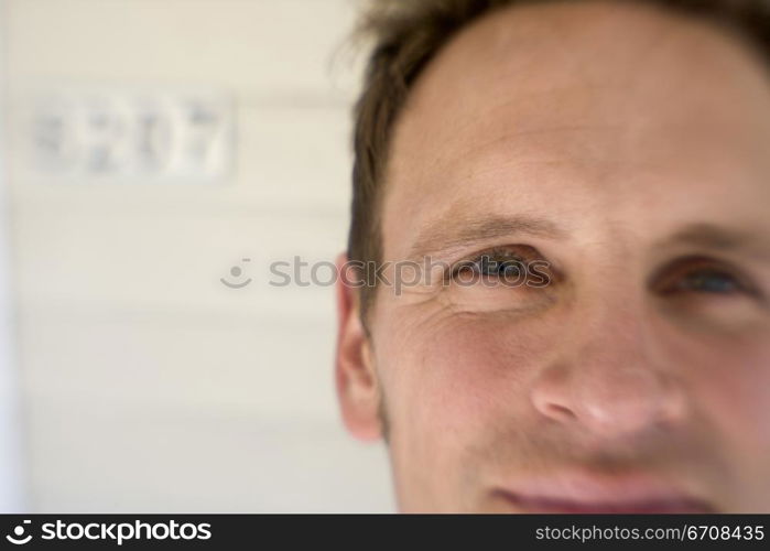 Portrait of a mid adult man smirking