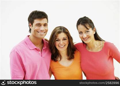 Portrait of a mid adult man standing with a mature woman and mid adult woman