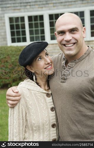 Portrait of a mid adult man standing with a mature woman and smiling
